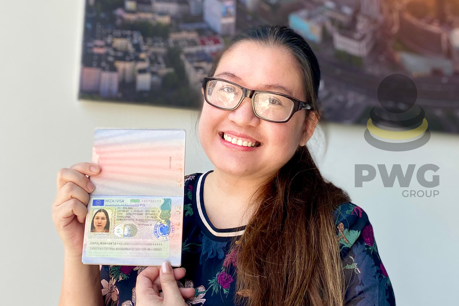 A-girl-in-glasses-showing-her-passport-visa-details